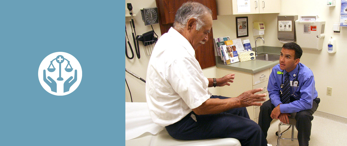 Dr. Charles Peter Vega Jr. working with a Hispanic patient at UCI's family Health Center in Santa Ana.
